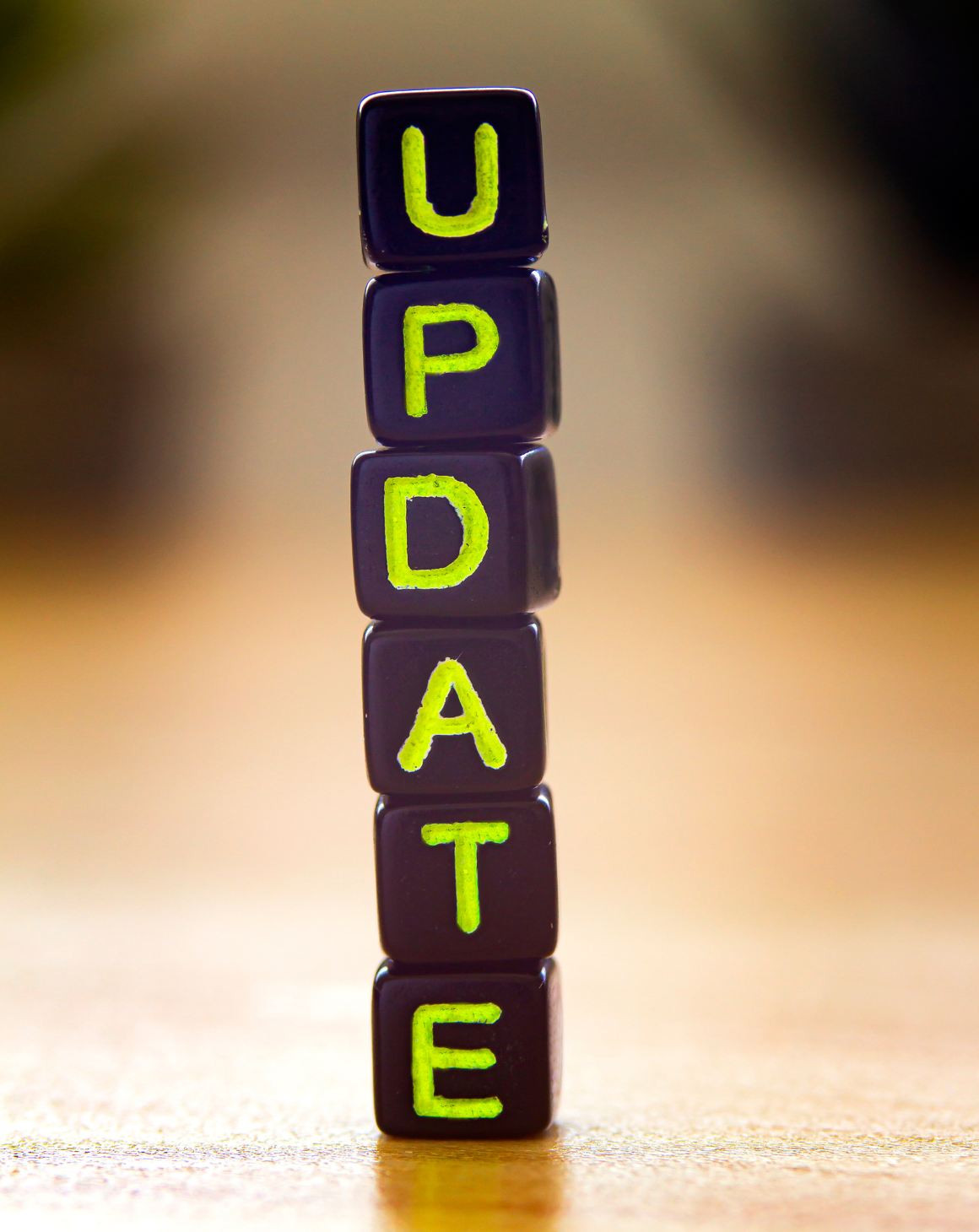 a stack of cubes with letters and the word update