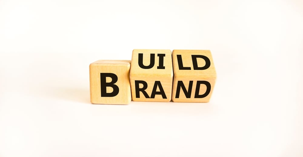 letter blocks spelling "build brand"