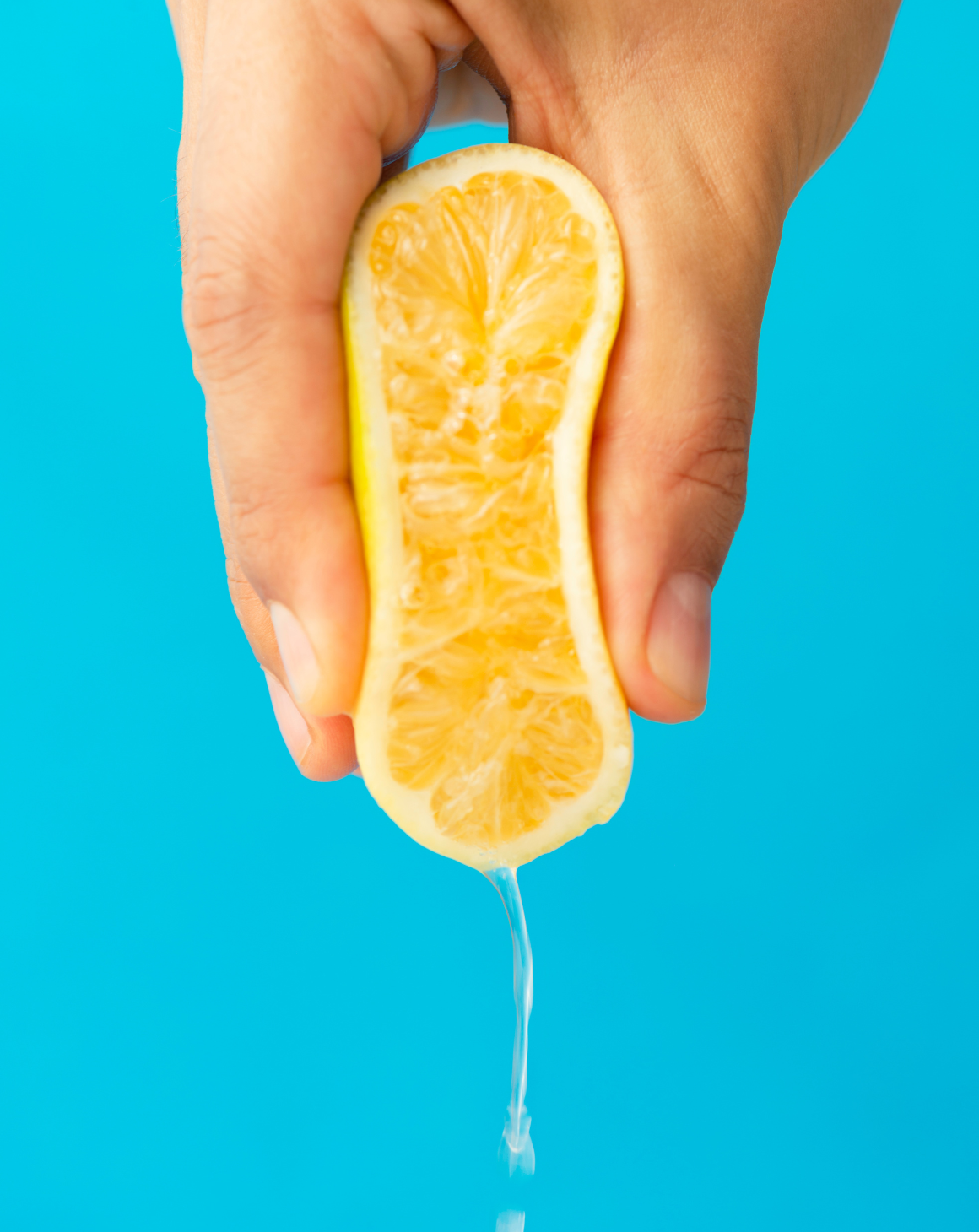 hand-squeezing-lemon-juice