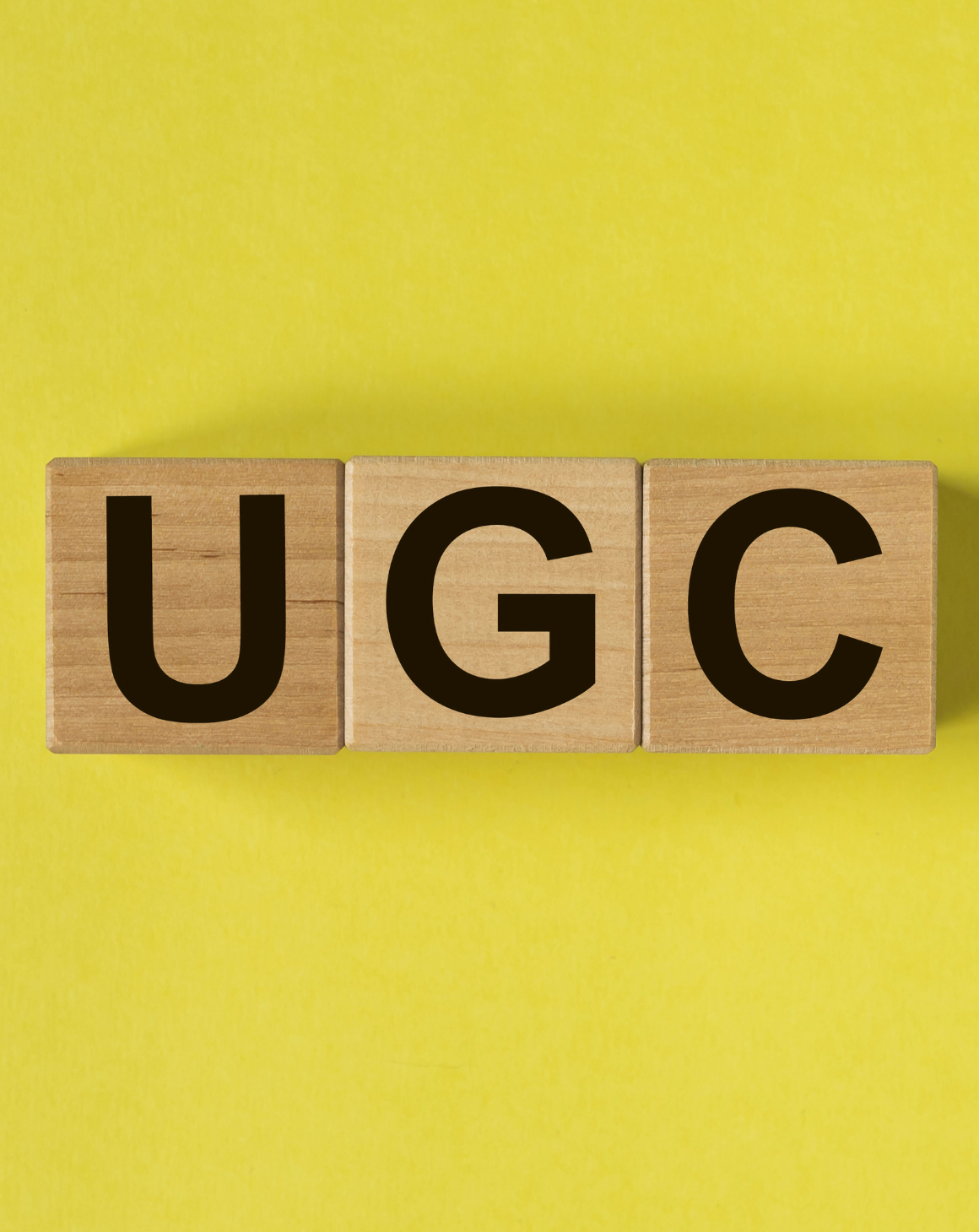 UGC letters on a yellow background