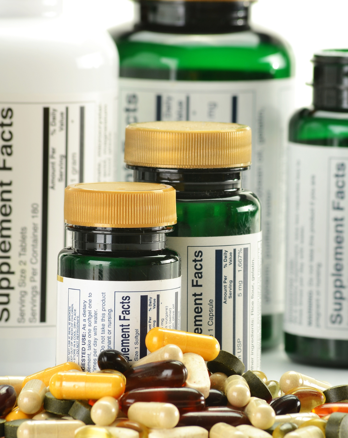 vitamins + bottles showing supplement facts